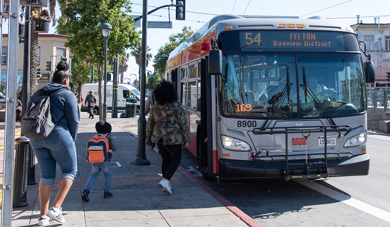 People in Bayview boarding a 54 coach.