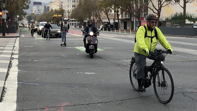 Bikes riding down Market Street.