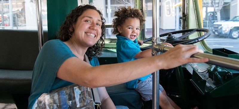 Mother and child on a historic trolley.