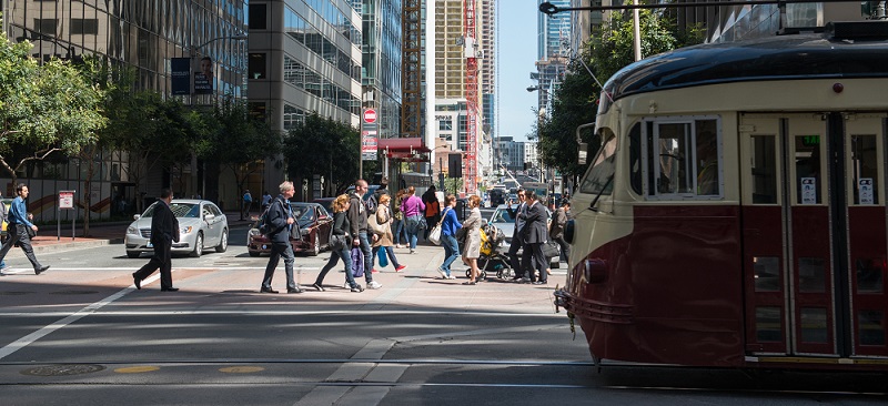 People crossing the street downtown.