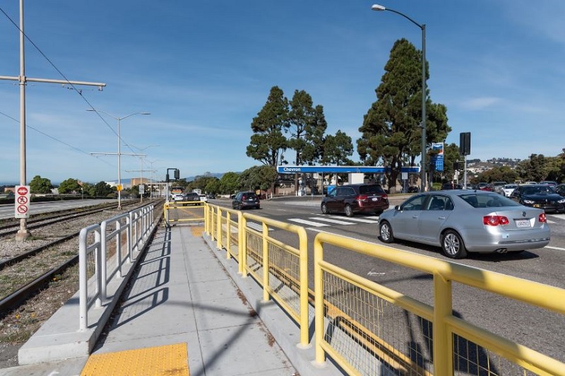 New pedestrian refuge for people walking across 19th Avenue.