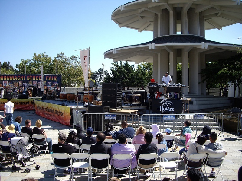 People in Japantown listening to music