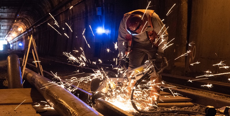 A man working on the Twin Peaks Tunnel.