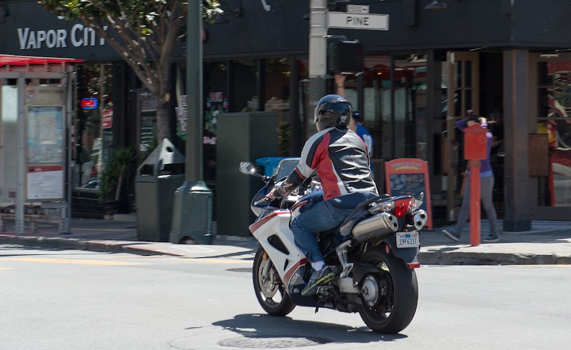 Motorcycle crossing Pine Street.