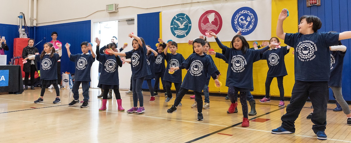 First grade students from Rosa Parks Elementary School performing at groundbreaking ceremony for Geary 