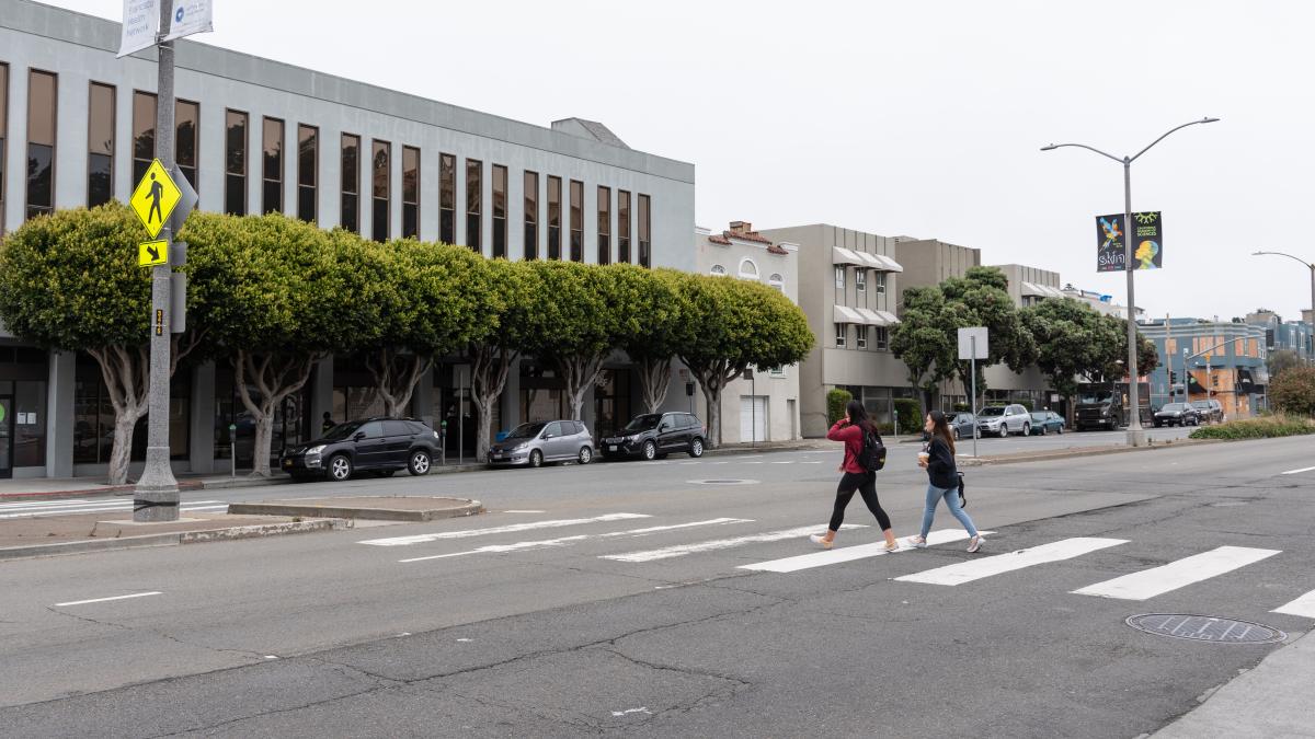 Image shows pedestrians crossing Geary and Commonwealth/Beaumont