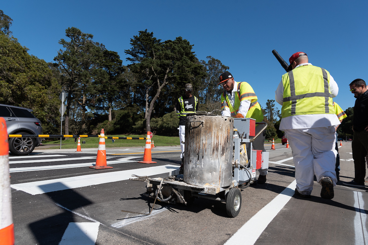 Paint shop striping a crosswalk in Golden Gate Park