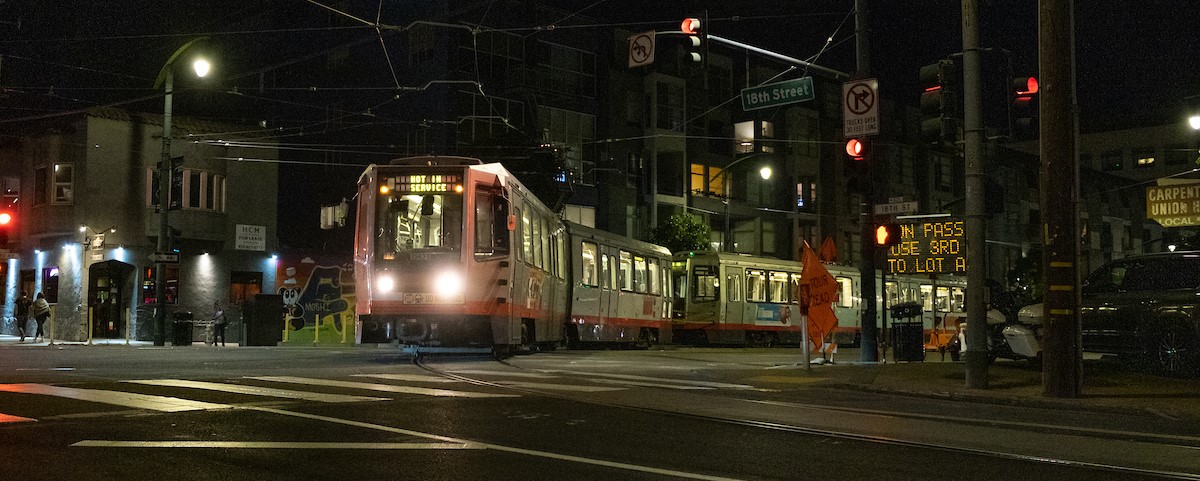 Trains using the Mission Bay Loop on 18th Street
