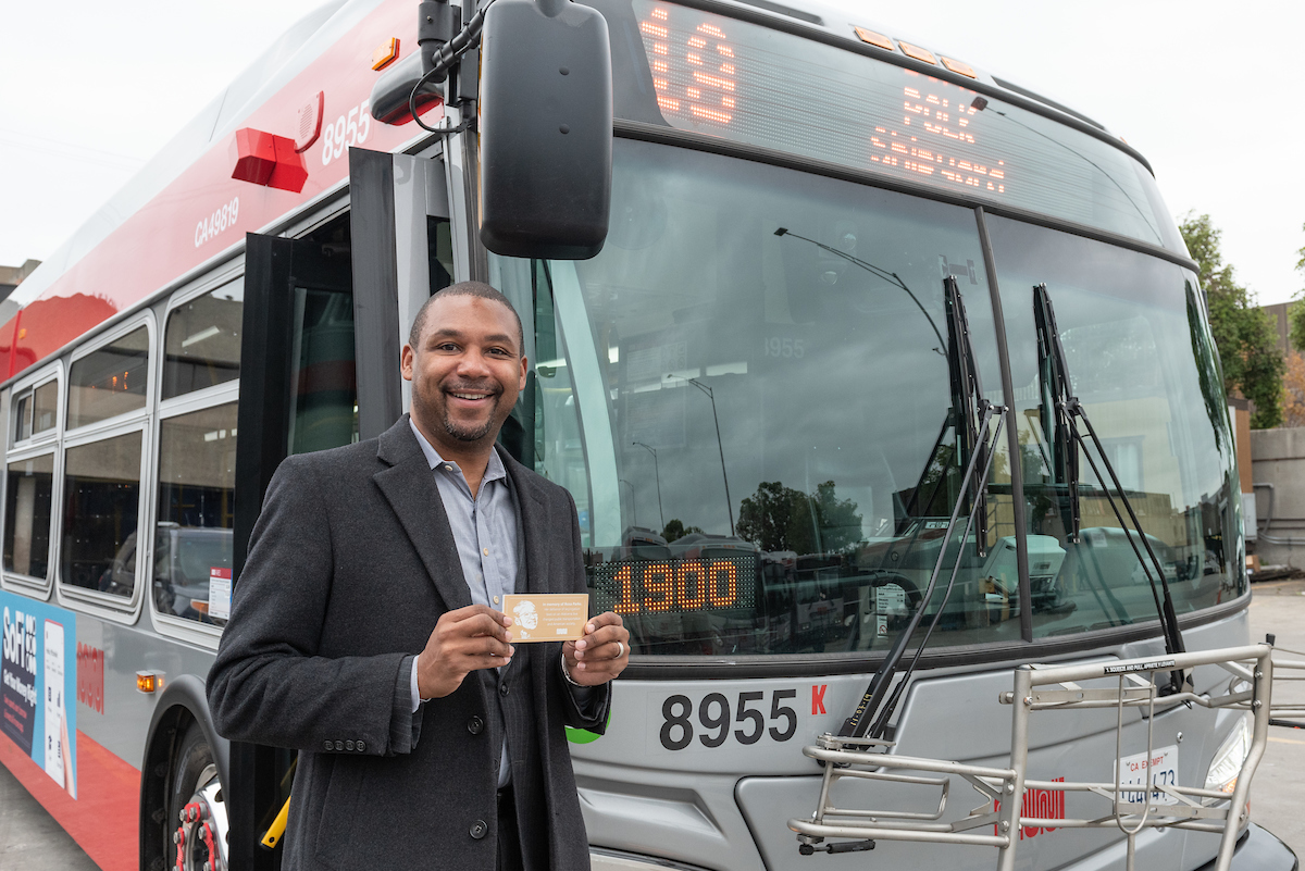 Supervisor Walton with Rosa Parks plaque in front of 19 Line coach