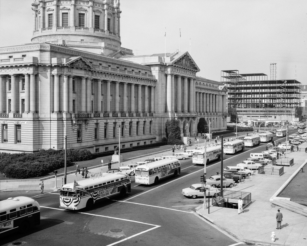 overhead view of bus parade with city hall