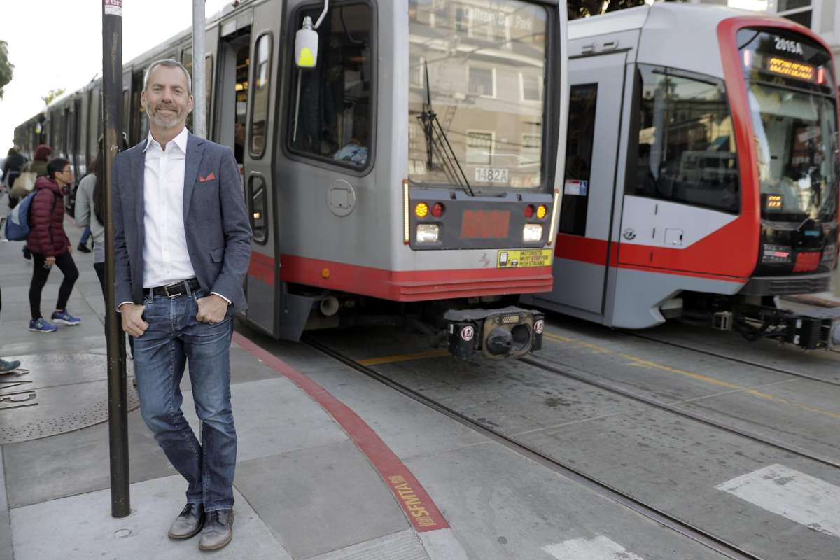 Jeff Tumlin with Muni trains