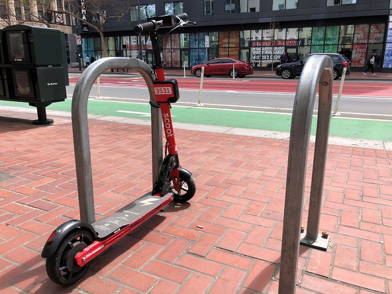 Scooter locked to rack