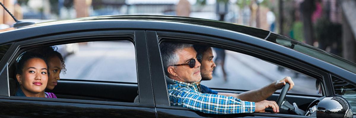 four people carpooling together