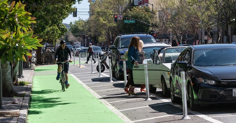 Man biking on the Valencia Street bike path