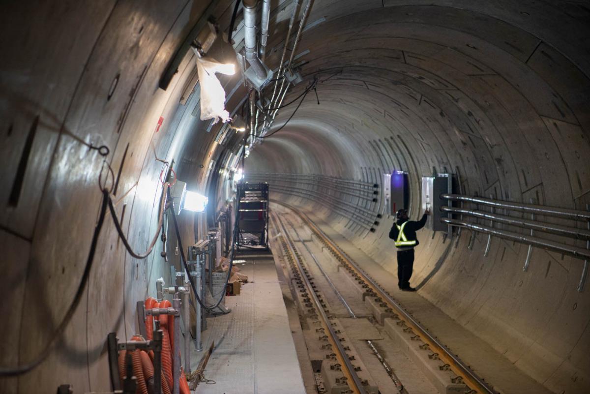 Conduits for electrical, communications, and signaling systems, are being installed inside the northbound tunnel.