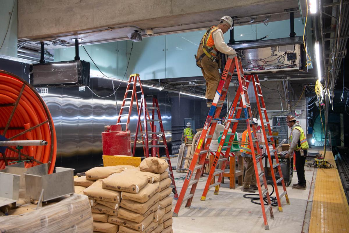 Electronic display boxes are being installed at the north end of Yerba Buena/Moscone Station's platform.