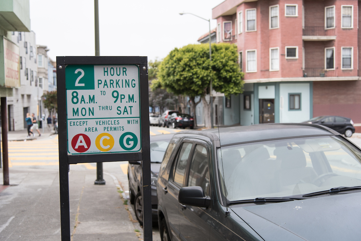 A picture of a residential parking sign
