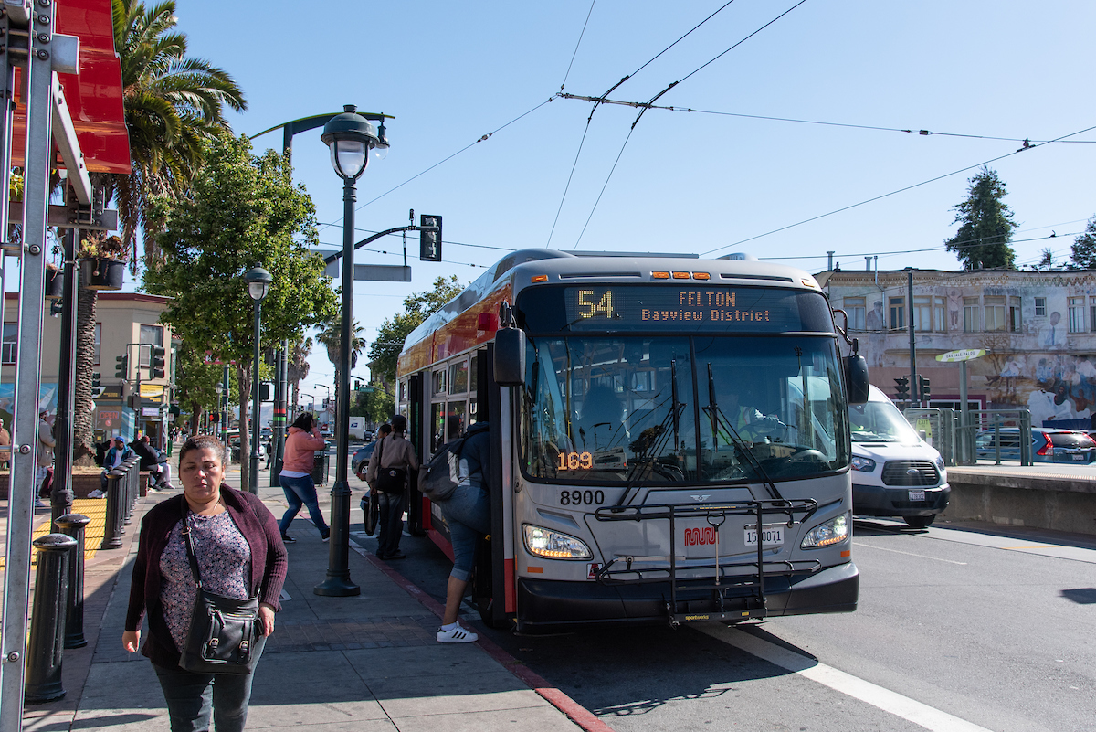 54 Bus picking up customers in the afternoon