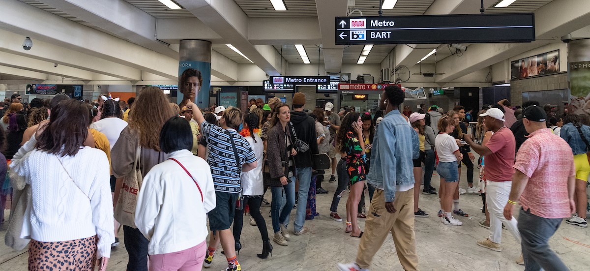 people heading into the subway at Civic Center Station