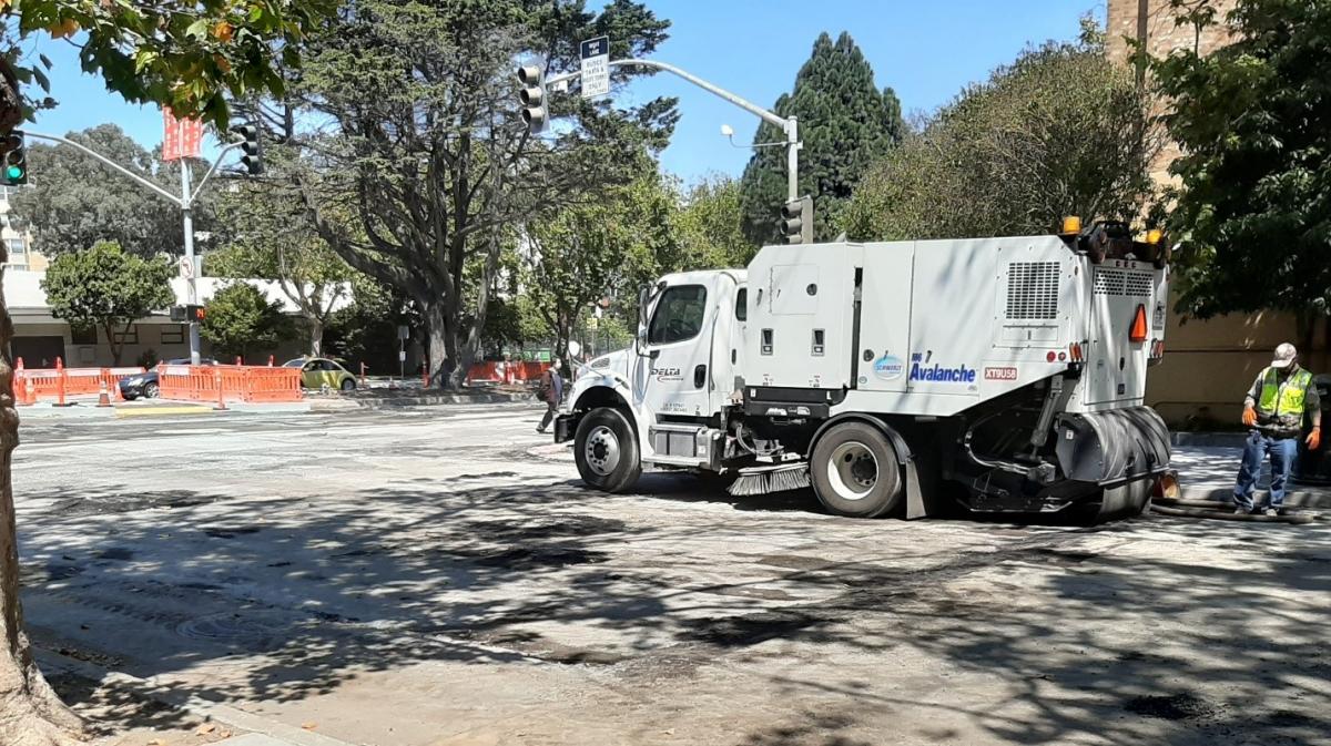 Crew prepares to clean roadway between Scott and Steiner streets.