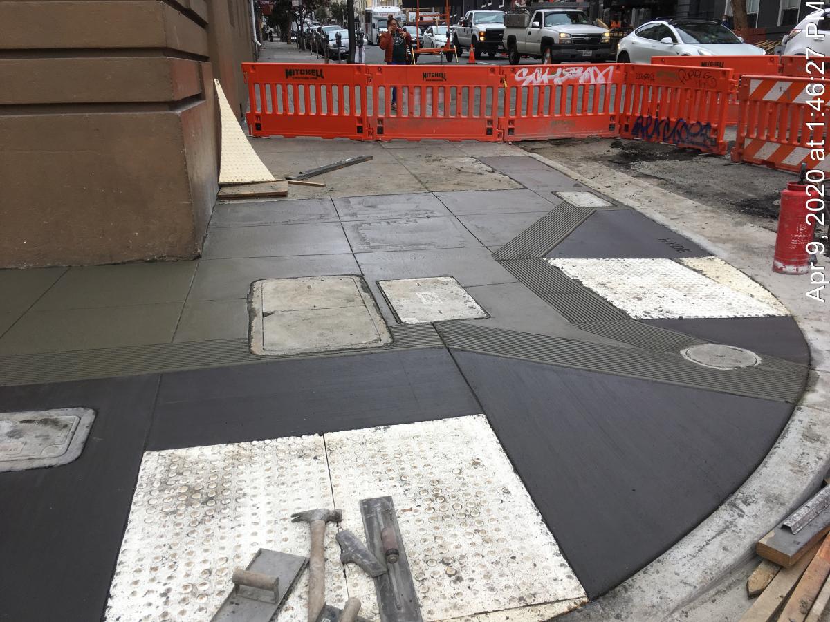 Photo of new concrete accessible curb ramps.