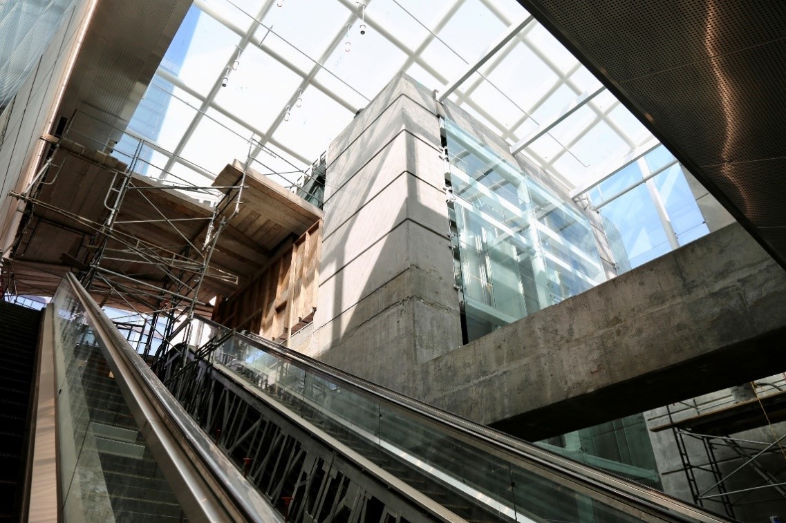 Lots of natural light and exposed concrete from the skylights for the entrance underground at Yerba Buena/Moscone Station. 