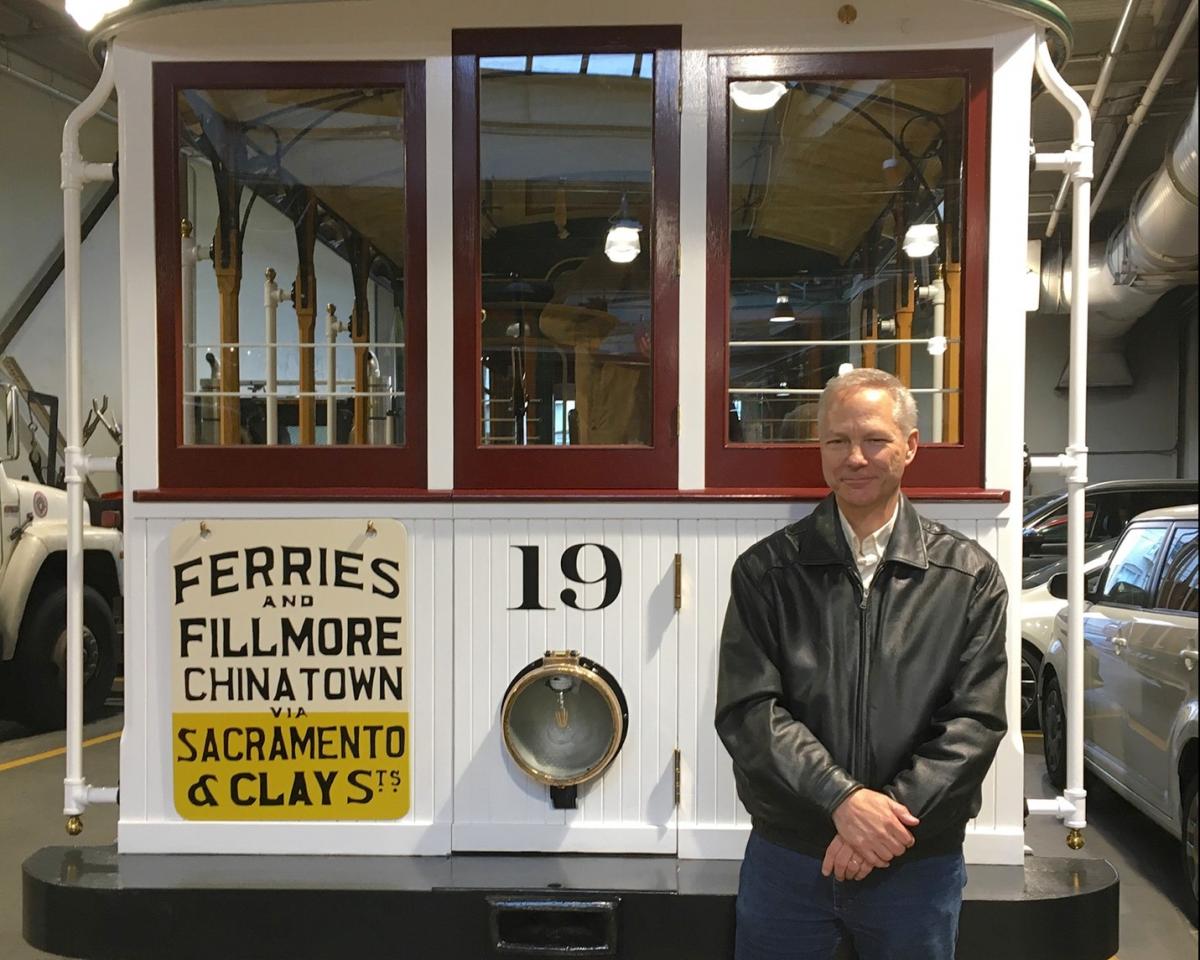 Author Paul Bignardi poses with Sacramento-Clay Cable Car 19 “Big 19” after its restoration in 2019.