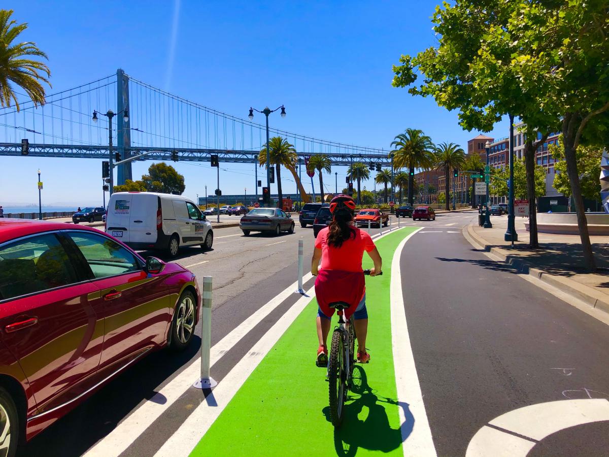 biker on the Embarcadero with Bay Bridge