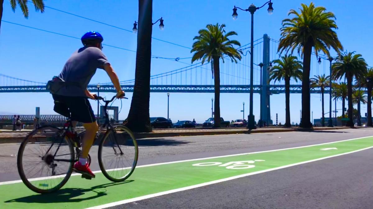 biker on the Embarcadero with Bay Bridge