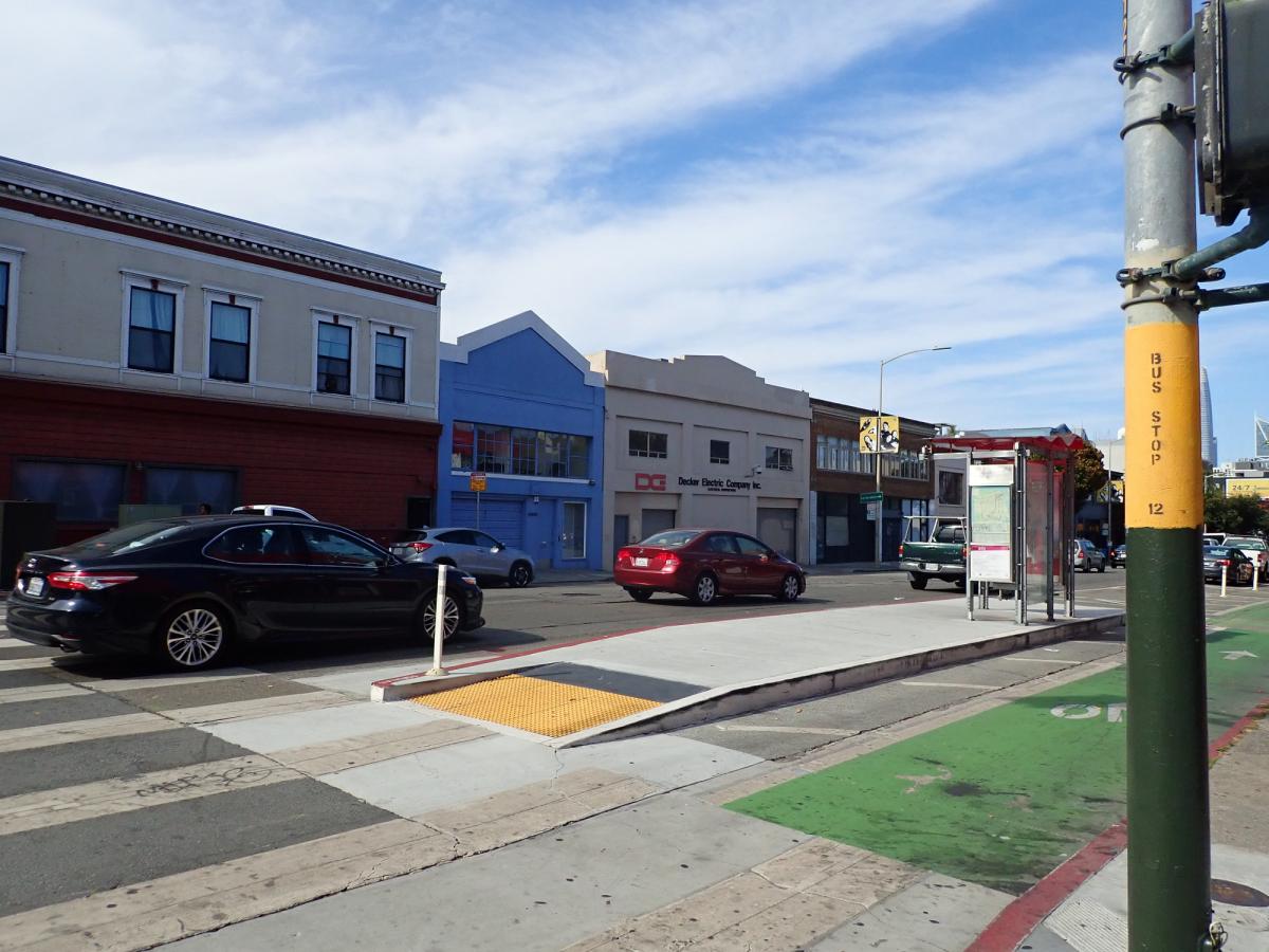 transit boarding island with curb ramp and transit shelter