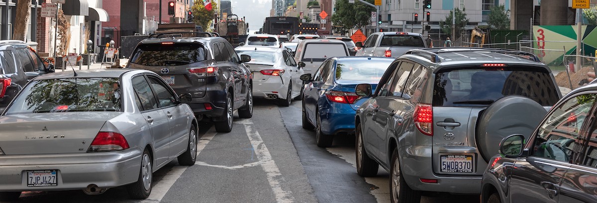 Cars merging in downtown traffic