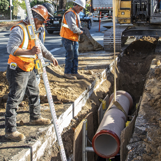 Image of crews installing new sewer mains