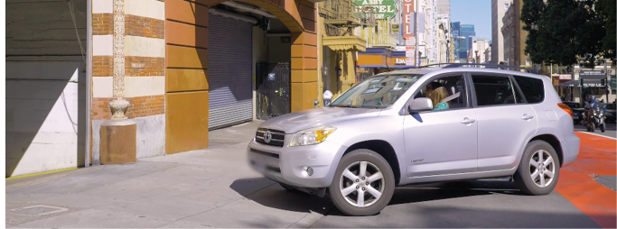 Car turning into garage from transit lane