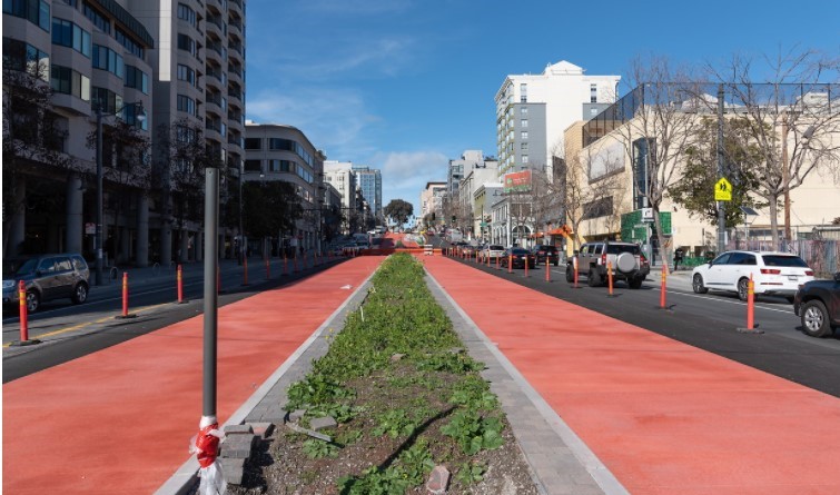 Looking north at completed red transit lanes along Van Ness at Golden Gate