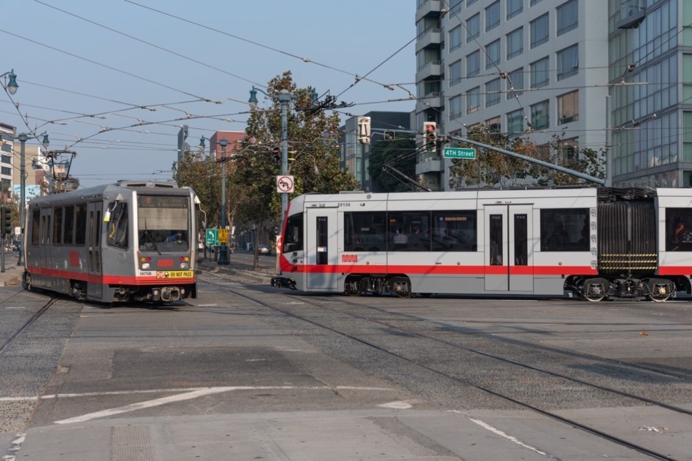 Photo showing two KT Ingleside-Third trains at the intersection of 4th and King streets