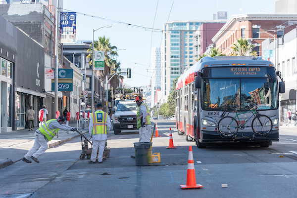 Paint Shop Crew Grinding Old Pavement Markings for Installation of Transit Only Lanes on Mission Street on September 23, 2020