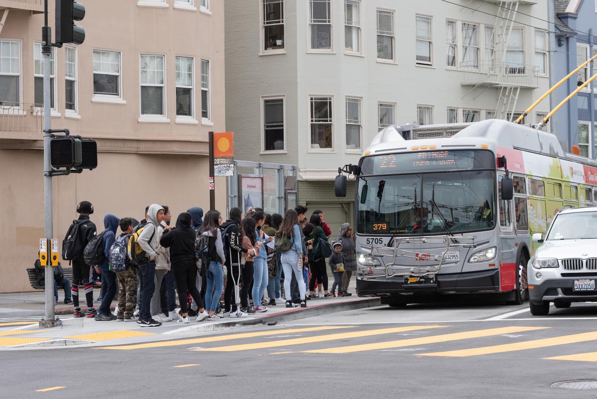 Students board at transit boarding island on 22 Fillmore route near Marina Middle School