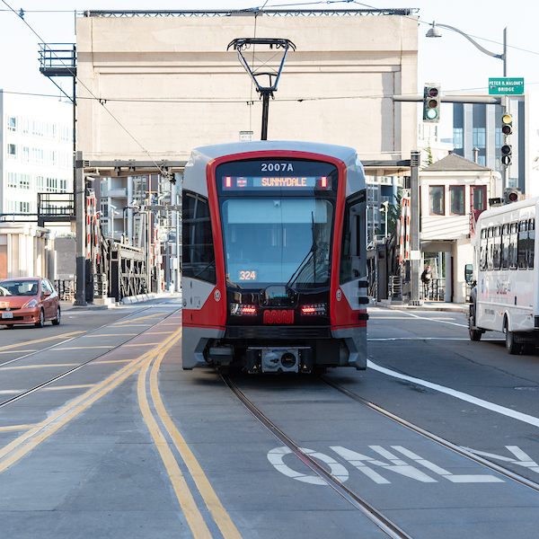 Photo of a Sunnydale-bound T Third approaching the 4th Street Bridge