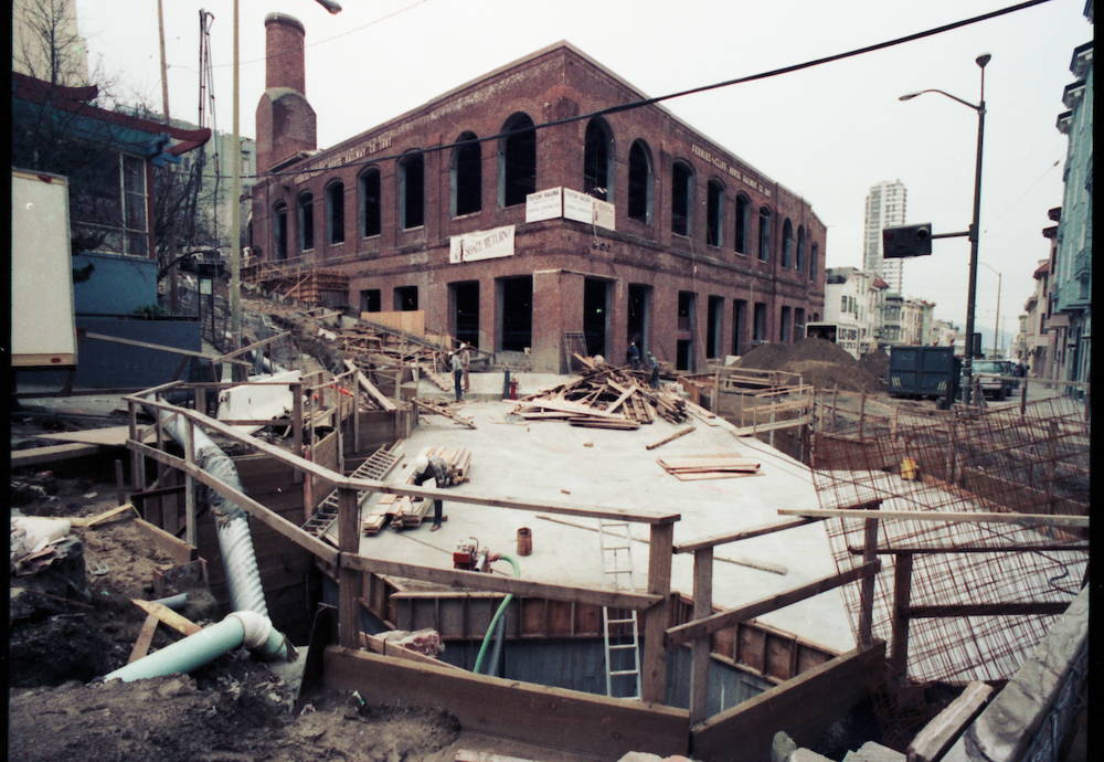 brick building with construction in foreground