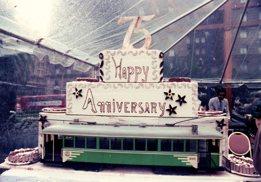 cake and model of streetcar decorated to celebrate Muni's 75th Anniversary