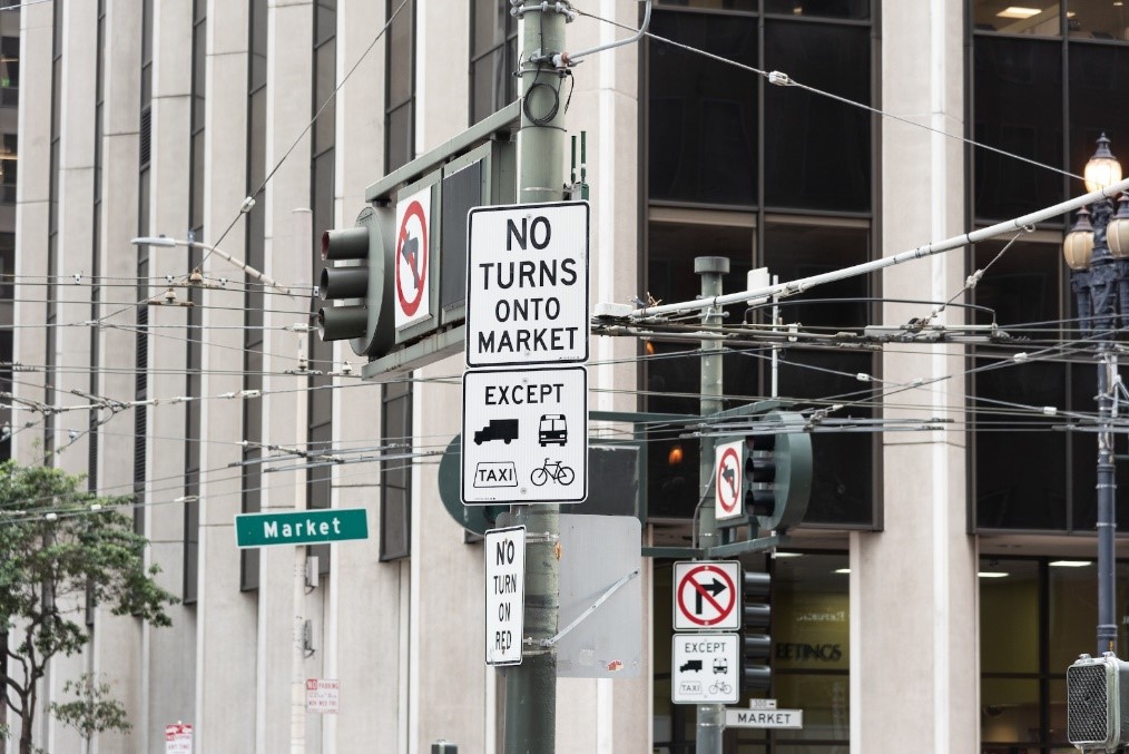 Photo of signs on Market Street indicating restrictions to private vehicles.