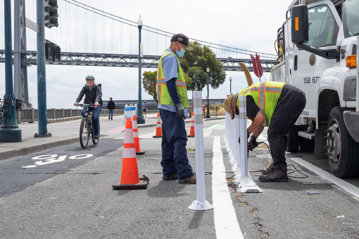 Sign Shop Crew Installing Safe Hit Posts Along New Bicycle Facilities on Embarcadero 