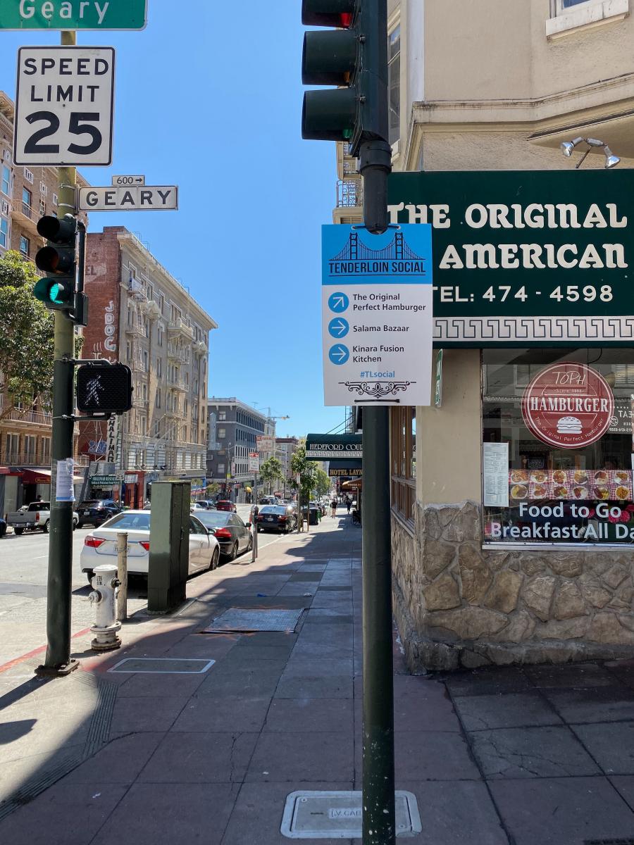 Image of construction wayfinding signage on Geary at Jones street showing local businesses 