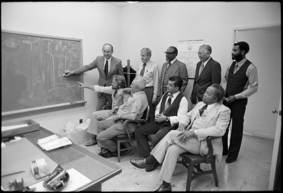 Gene Henderson (seated, fourth from the left) is pictured here with Muni's Claims Department staff in 1979, just one year before his retirement.