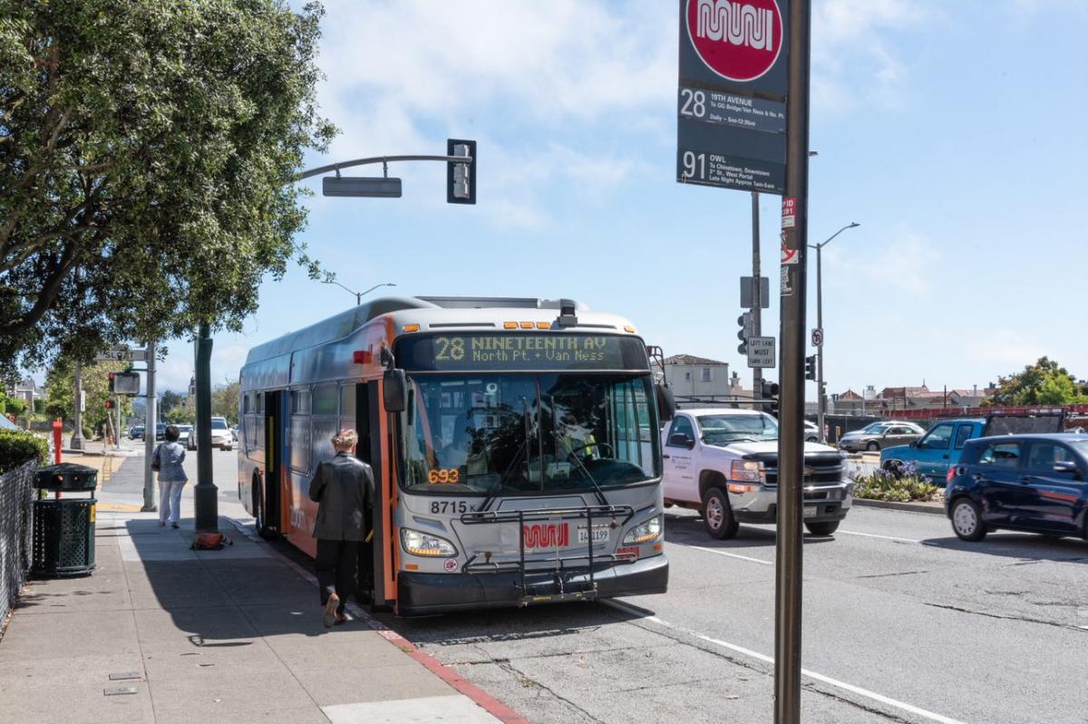 Photo of the 28-19th Avenue bus with a passenger boarding