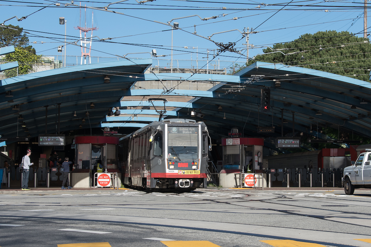 Pre-pandemic photo of K Ingleside train exiting tunnel at West Portal 