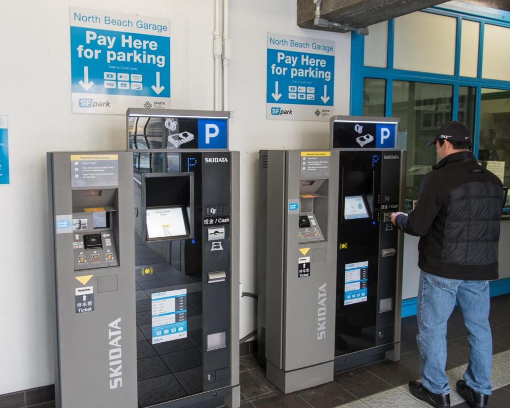 Photo of Customer using new PARCS kiosk at North Beach parking garage