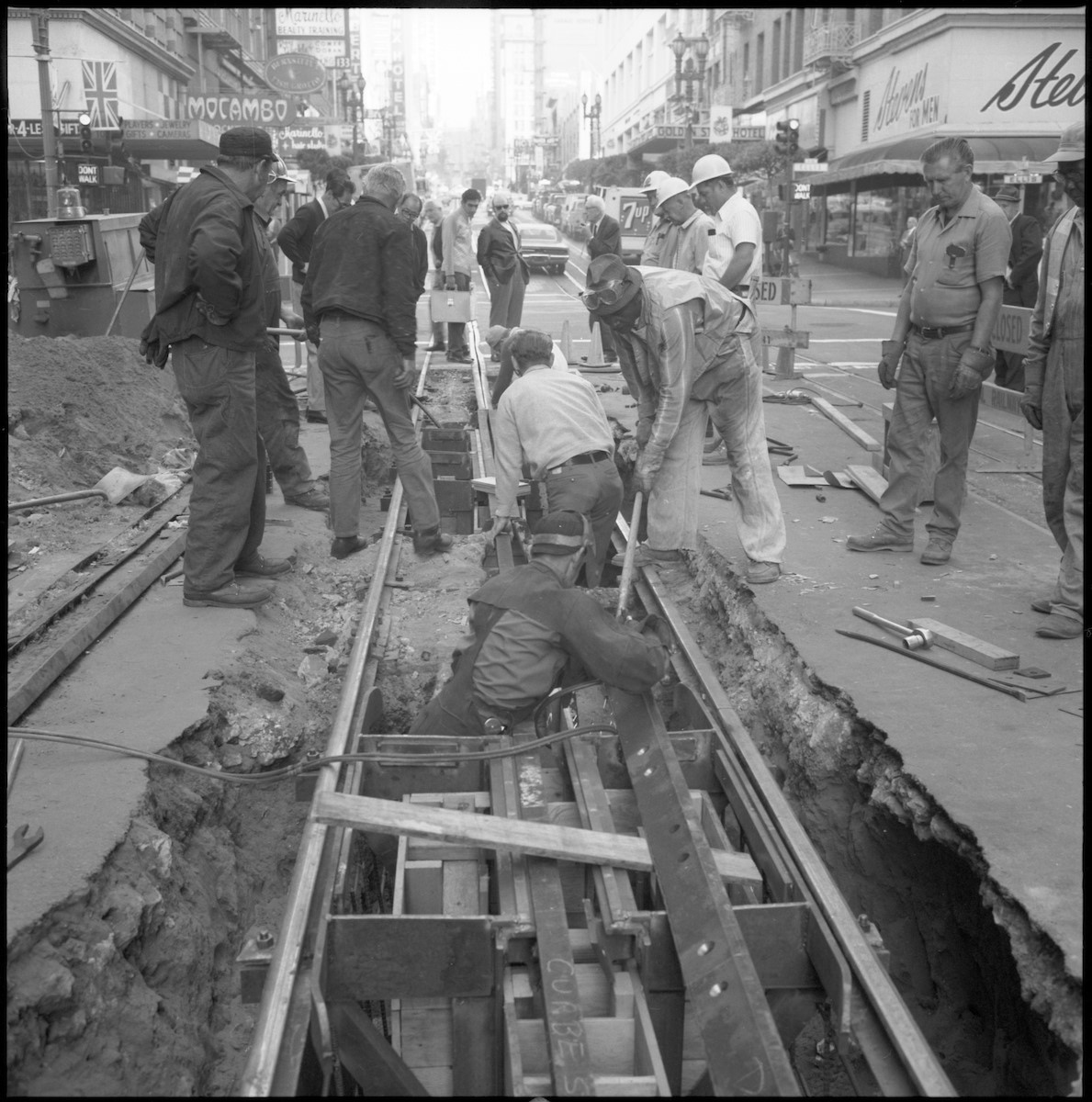 A track crew works to replace a depression beam and bumper bar 