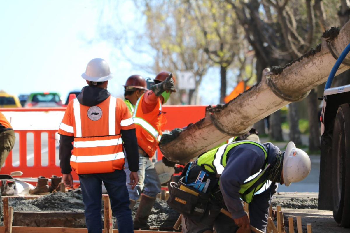 Photo: Esquivel Grading and Paving crew members pouring concrete along Geary. Photo courtesy of Esquivel Grading and Paving. 