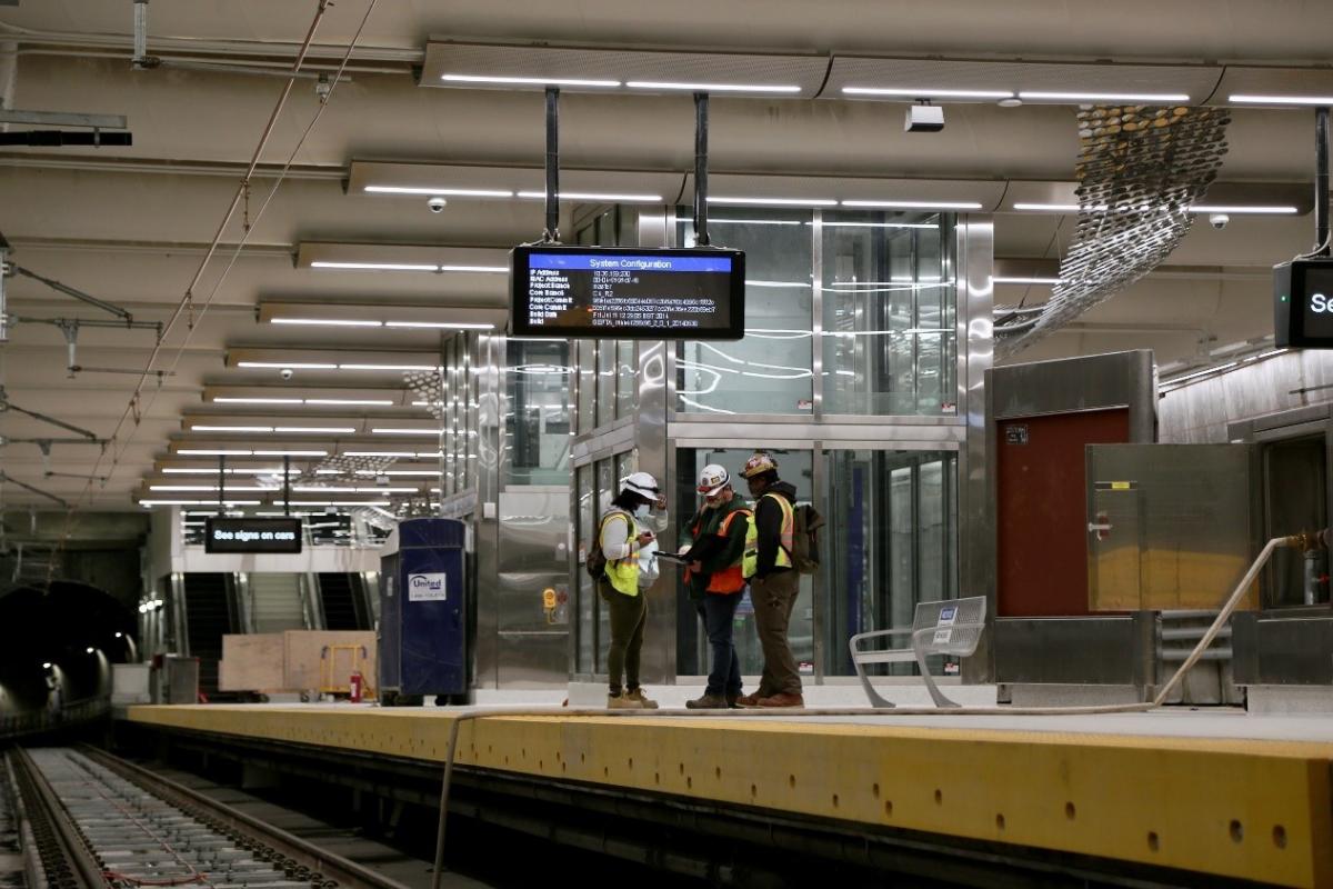 Photo of workers on a platform